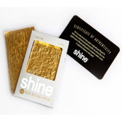 Image des papiers à rouler en or 24 carats de Shine, un choix luxueux pour rouler des cigarettes ou d'autres produits à fumer, connus pour leurs véritables feuilles d'or 24 carats.